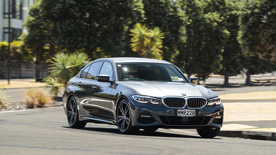 2019 BMW 330e driving through suburbs