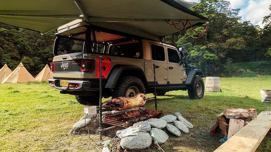 2020 Jeep Gladiator with lamb on a spit cooking in front