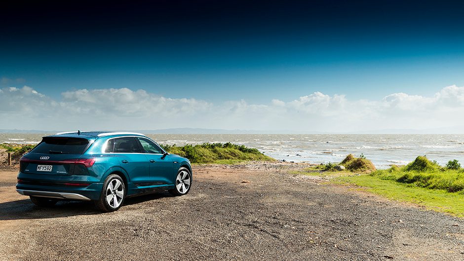 Audi e-tron 55 quattro rear static by water