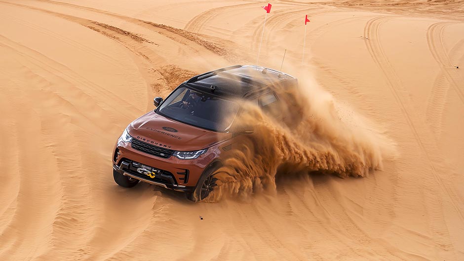 2017 Land Rover Discovery kicking up sand