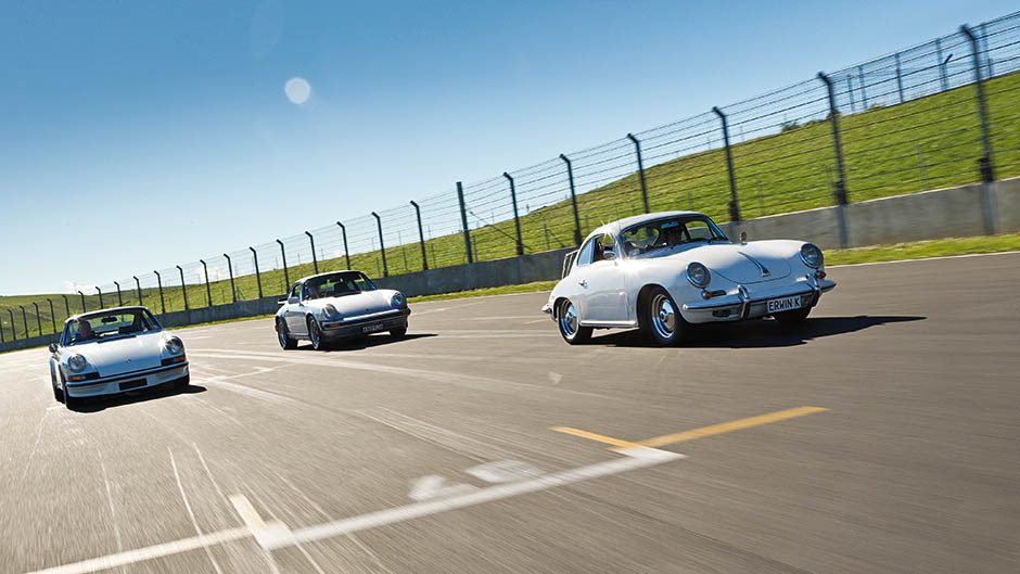 Porsche 911s racing on track
