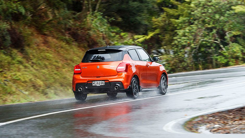 2020 Suzuki Swift Sport driving through bend