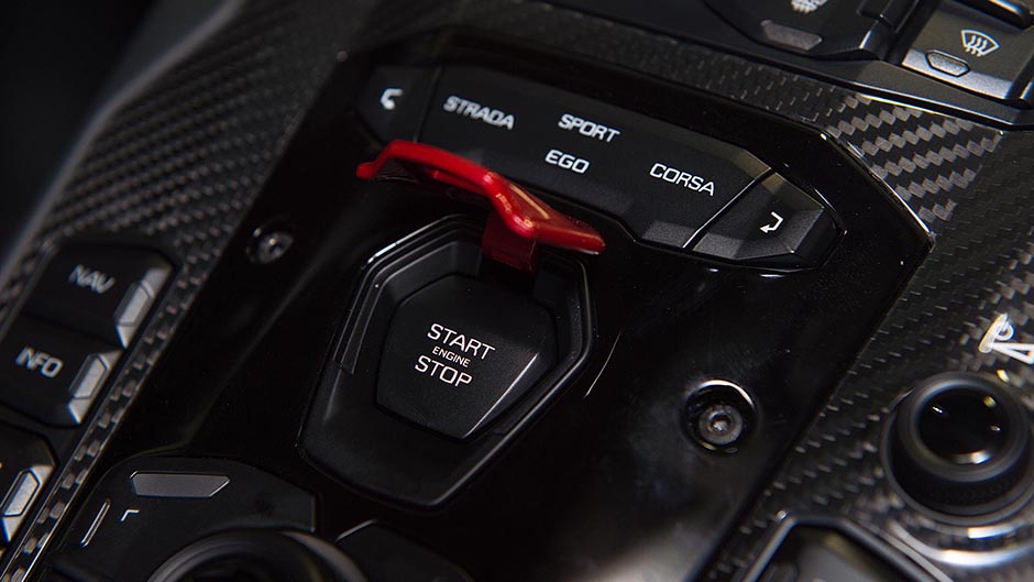 Lamborghini Aventador engine start button close up view