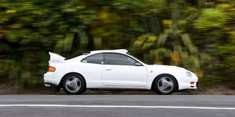 Toyota Celica GT-Four driving past trees