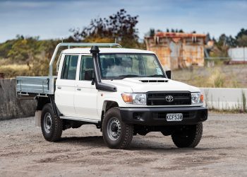 Toyota Land Cruiser 70 Series ute parked on gravel