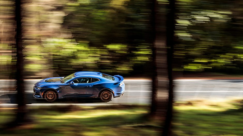 2019 Chevrolet Camaro ZL1 side action through trees