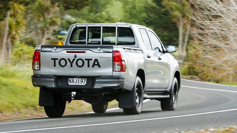 Toyota Hilux driving around corner on country road