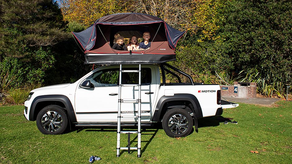 iKamper Rooftop tent mounted on VW Amarok with kids inside