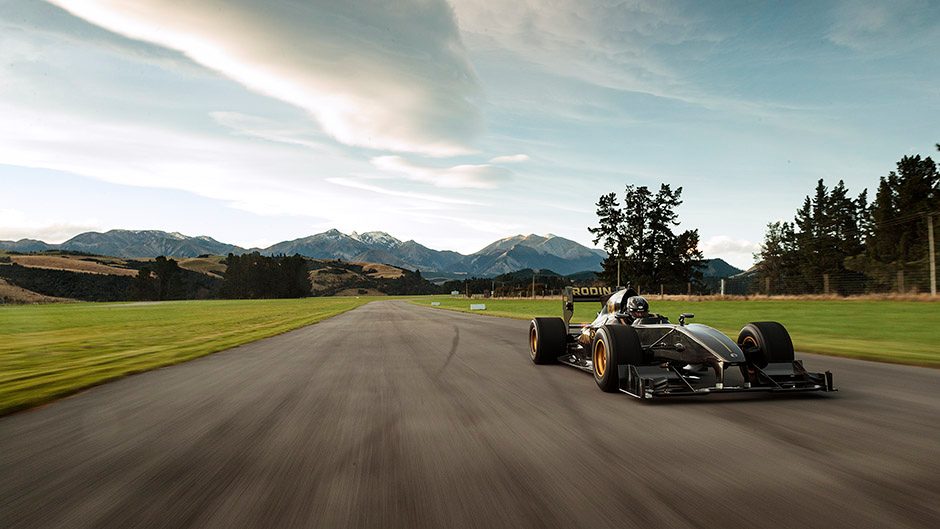 Rodin FZed on race track with mountains in background