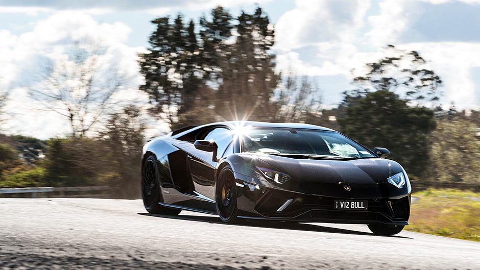 Lamborghini Aventador front three quarter view driving