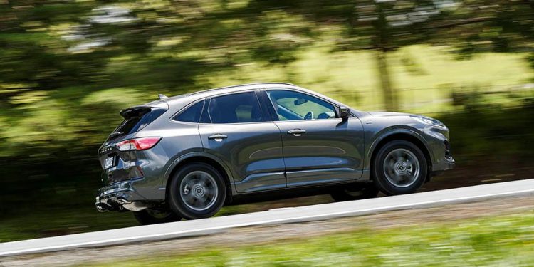 Ford Escape driving on country road