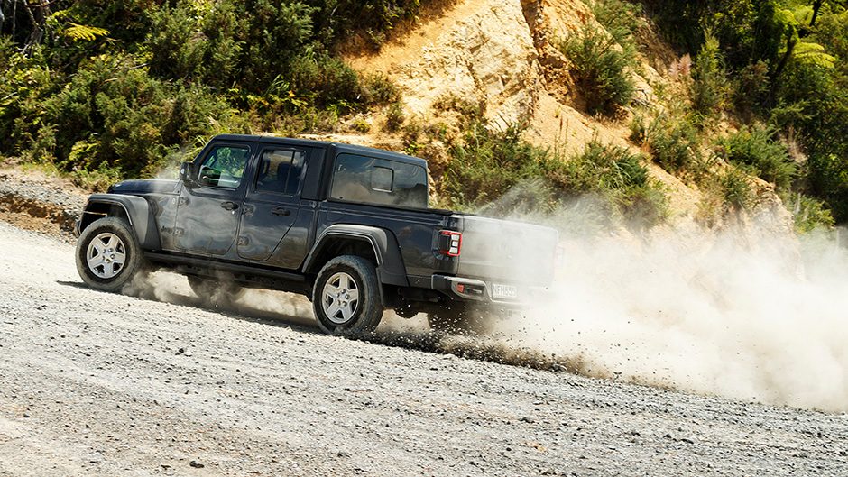2021 Jeep Gladiator Sport sliding on gravel road