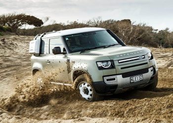 Land Rover Defender drifting in the sand