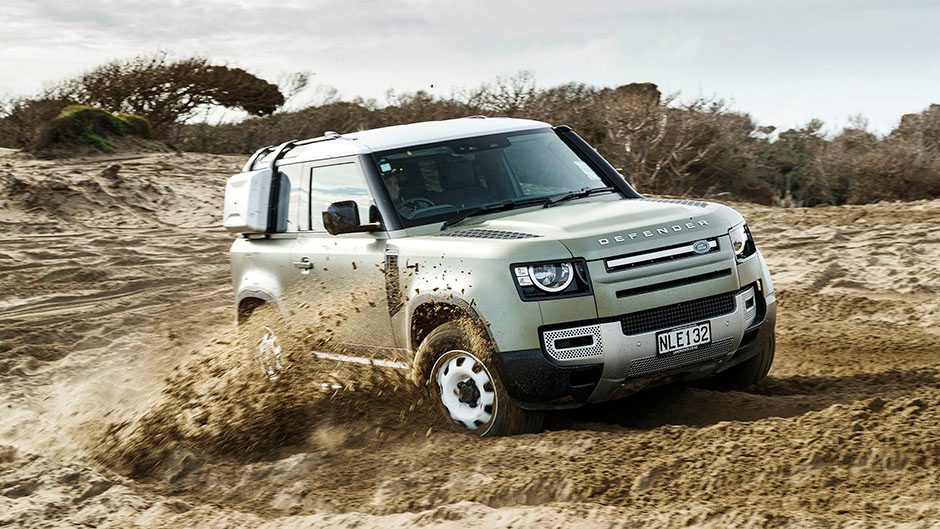 Land Rover Defender drifting in the sand