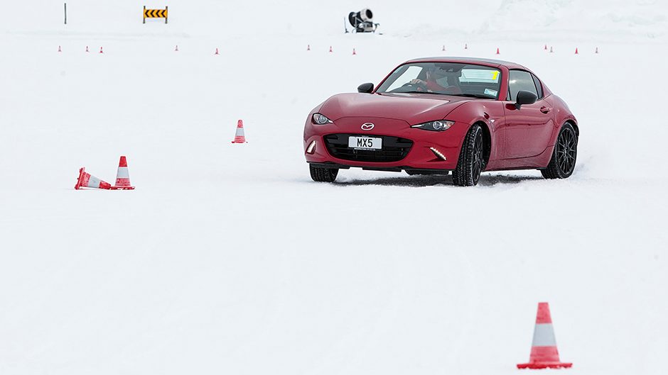 red Mazda MX-5 dab of oppo on snow