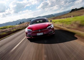 Tesla Model S driving on country road