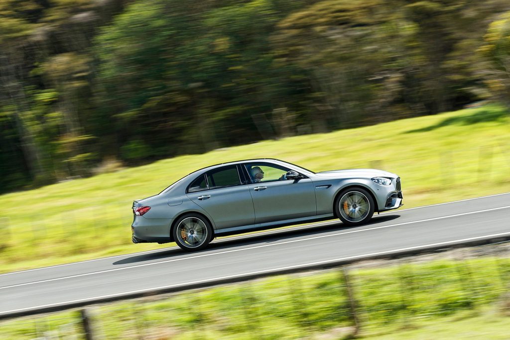 2021 Mercedes-AMG E 63 S 4matic+ driving past fields