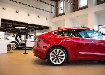 Tesla Model 3 rear quarter view in dealership