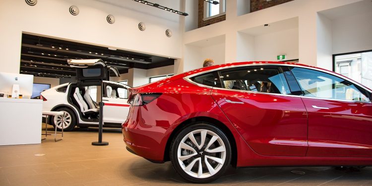 Tesla Model 3 rear quarter view in dealership