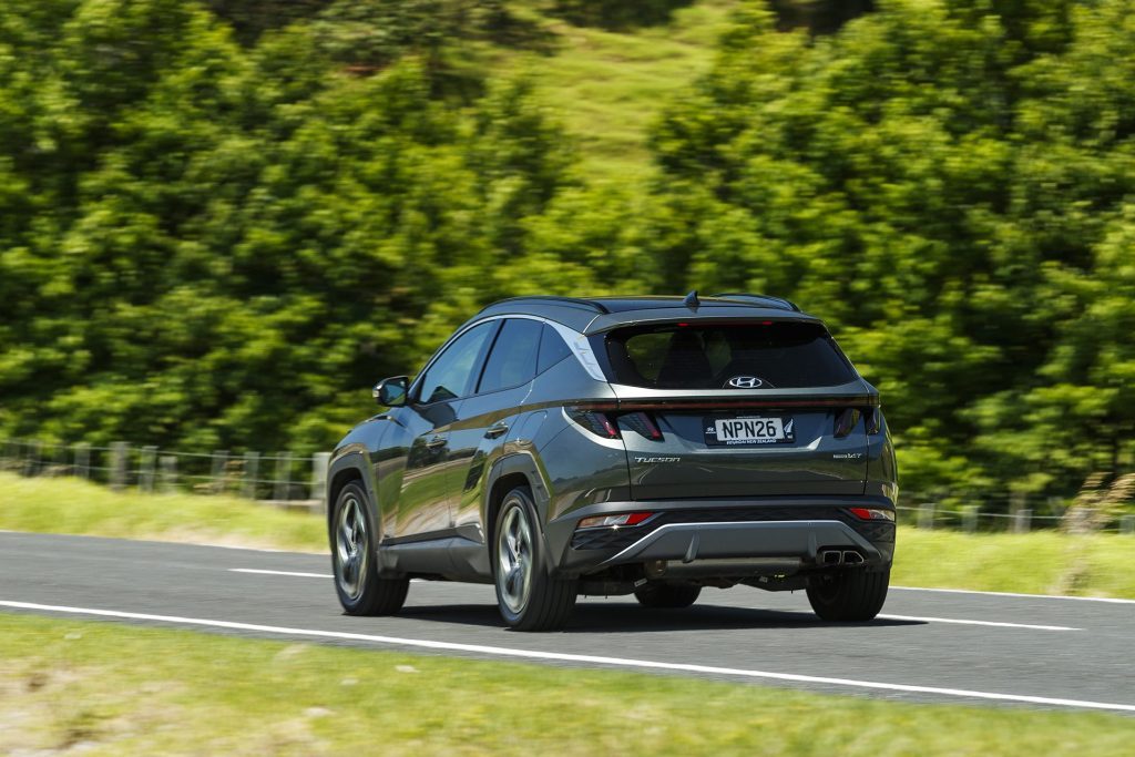 Hyundai Tucson driving on road