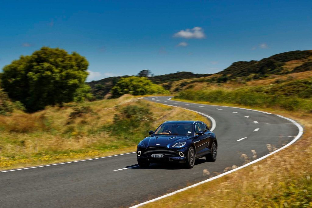 2022 Aston Martin DBX driving on windy road