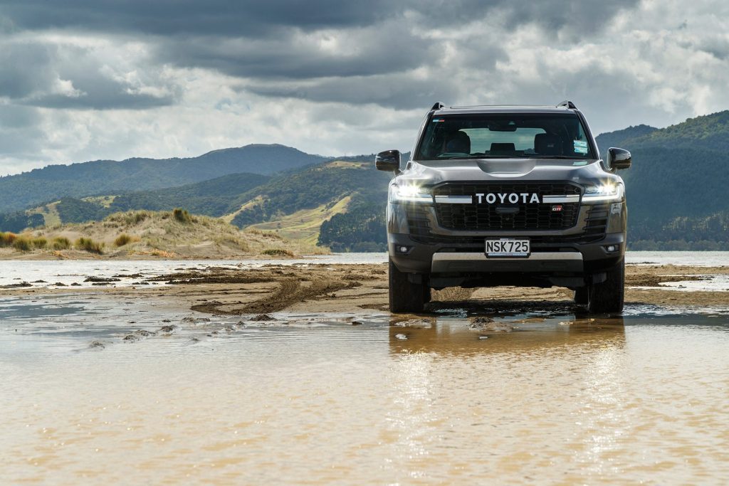 2021 Toyota Land Cruiser 300 GR Sport parked on beach