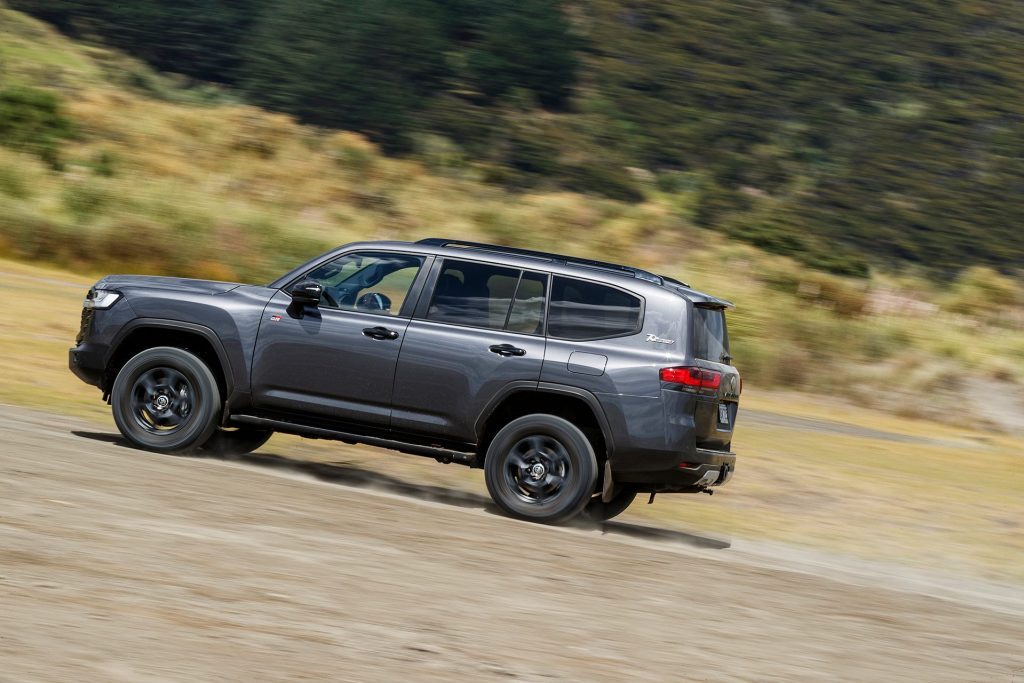 2021 Toyota Land Cruiser 300 GR Sport driving past trees