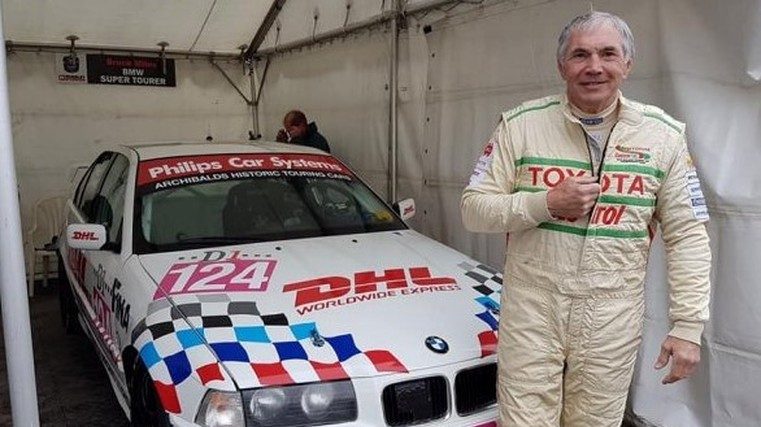 Bruce Miles standing in front of racecar