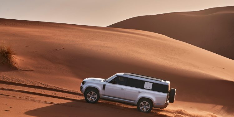 Land Rover Defender 130 on sand dune