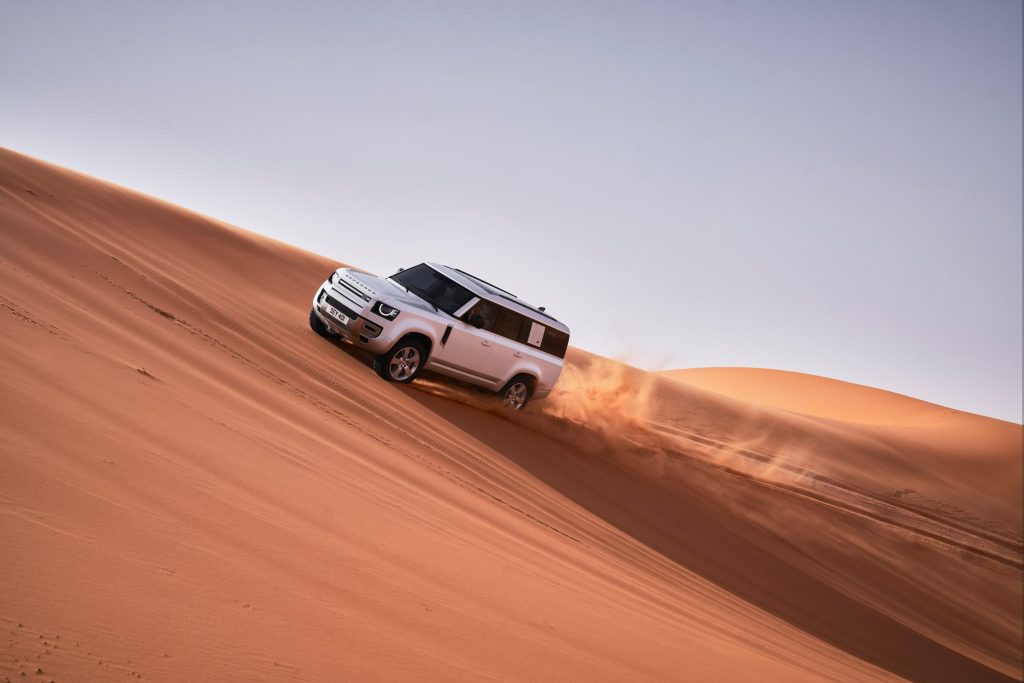 SUC driving up sand dune