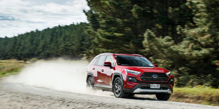 Toyota RAV4 front three quarters driving along gravel road