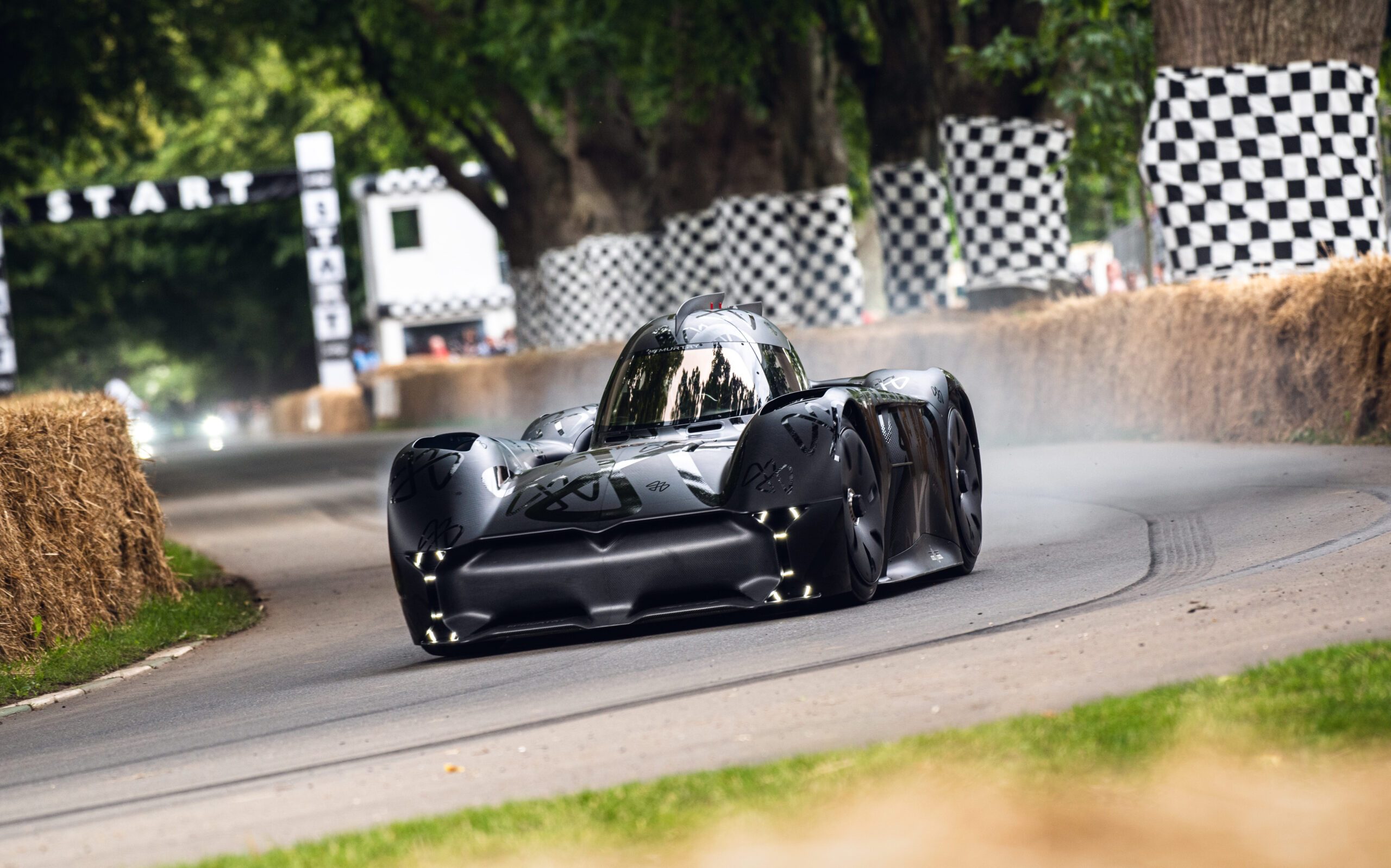 McMurty driving up Goodwood hillclimb