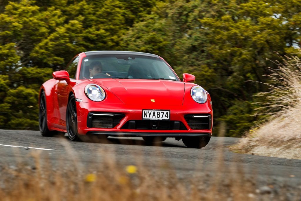 red Porsche 911 GTS front action