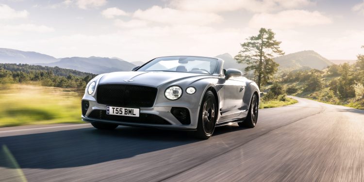 Bentley Continental convertible driving along road