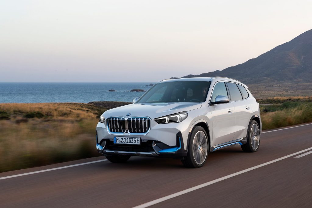 BMW X1 driving along road