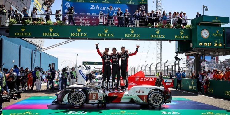 Toyota Gazoo Racing GR010 Hybrid on podium with Brendon Hartley