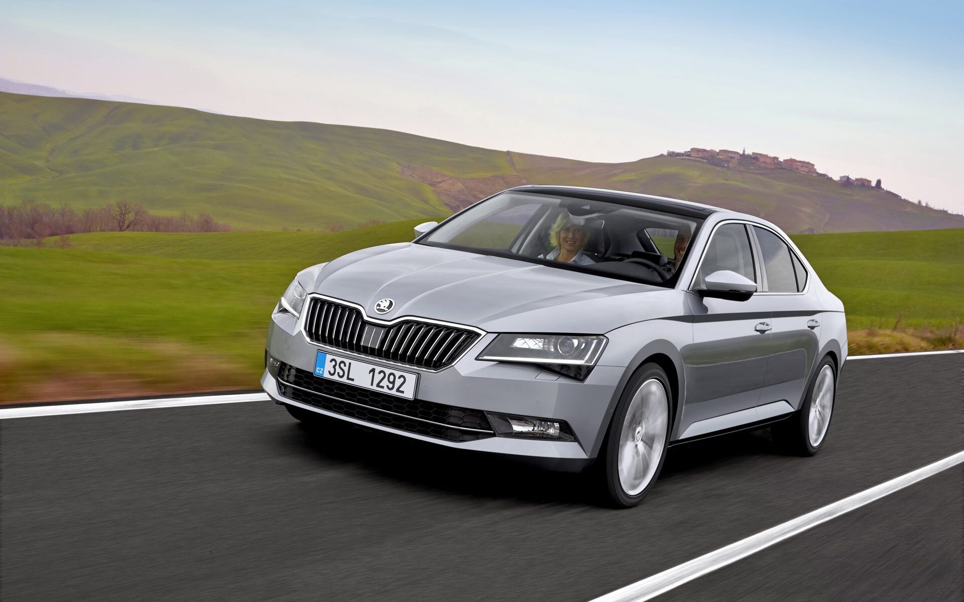 Skoda Superb front three quarters driving on road