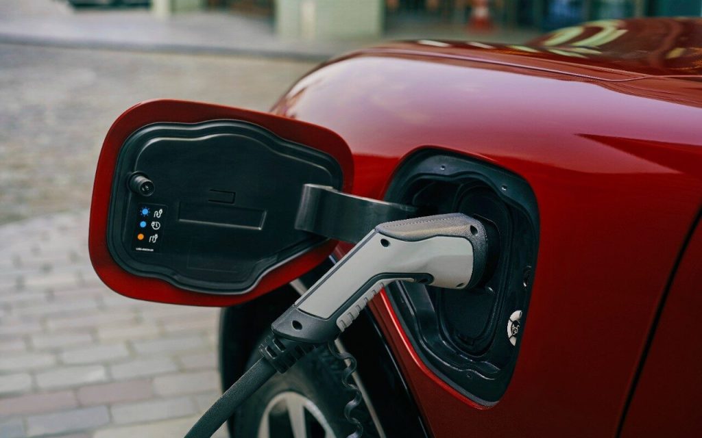 Ford Mustang Mach-E electric charging port open with charger plugged in