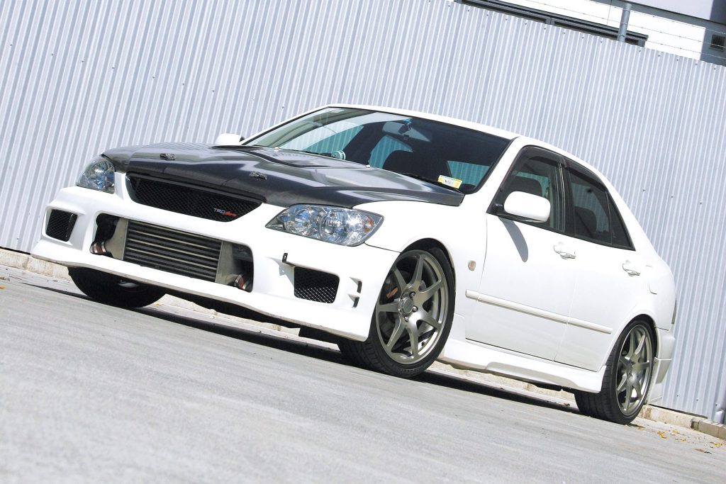 1999 Toyota Altezza RS200 Turbo parked in front of silver wall