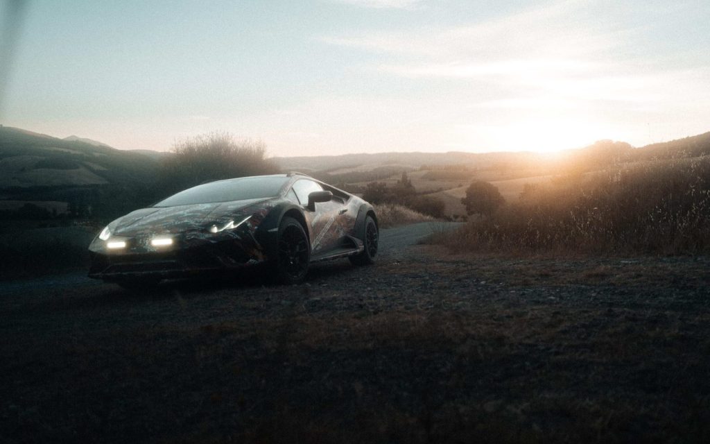 Lamborghini Huracan Sterrato all-terrain supercar driving off road front three quarters