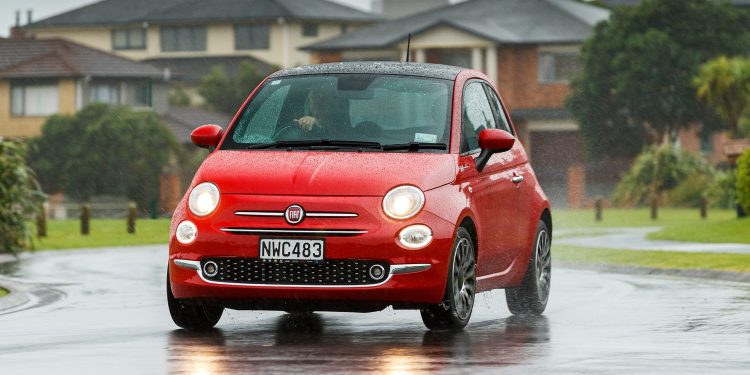 Fiat 500 Dolcevita driving through suburbia