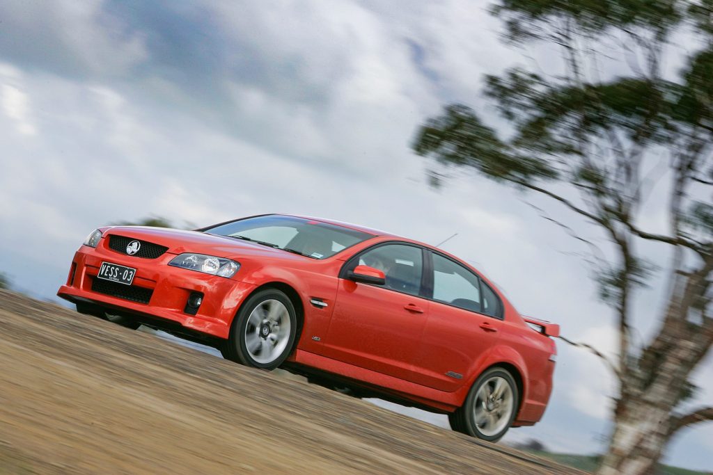 2006 Holden Commodore VE driving past trees