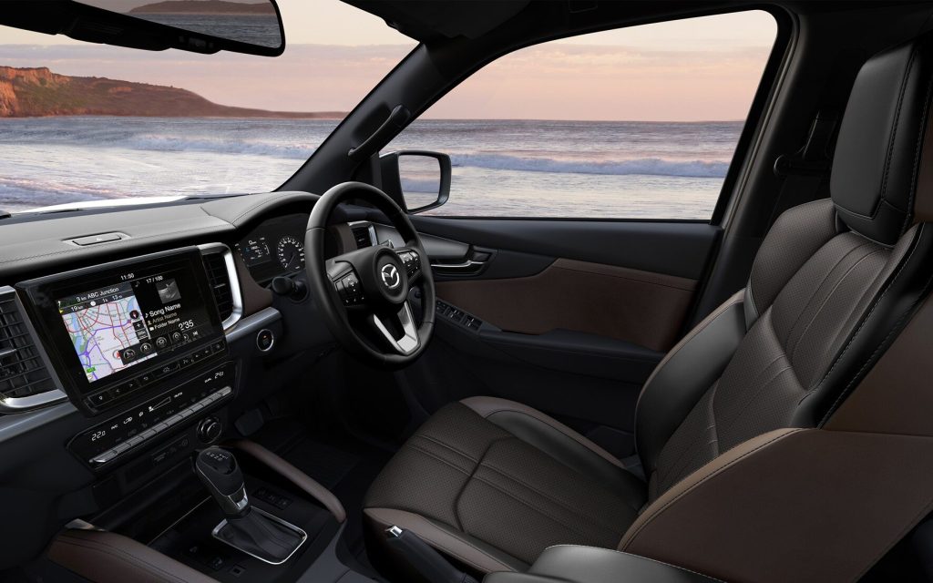 Mazda BT-50 interior with surf beach in background