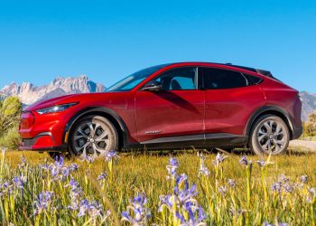 Ford Mustang Mach-E side next to mountains