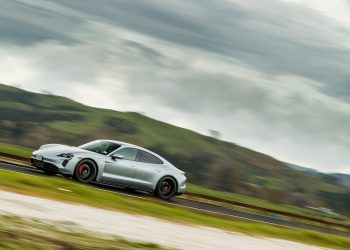 Porsche Taycan GTS driving through countryside