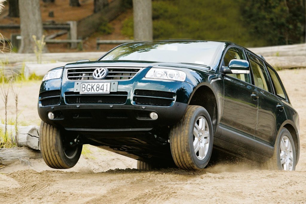  2003 Volkswagen Touareg jumping over sand dune