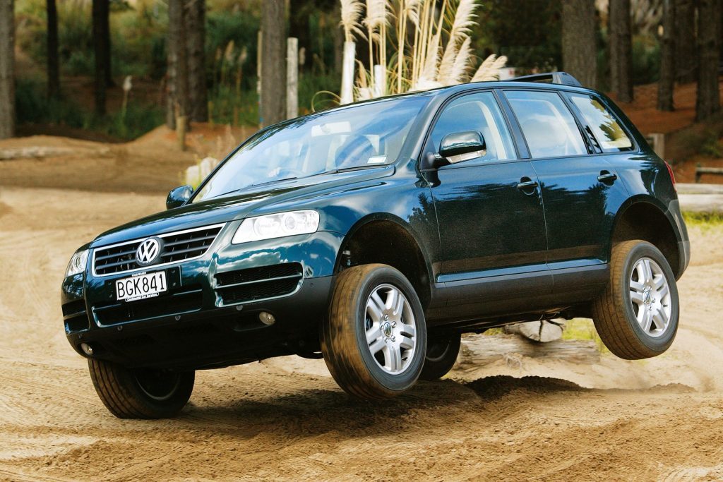  2003 Volkswagen Touareg jumping over sand dunes