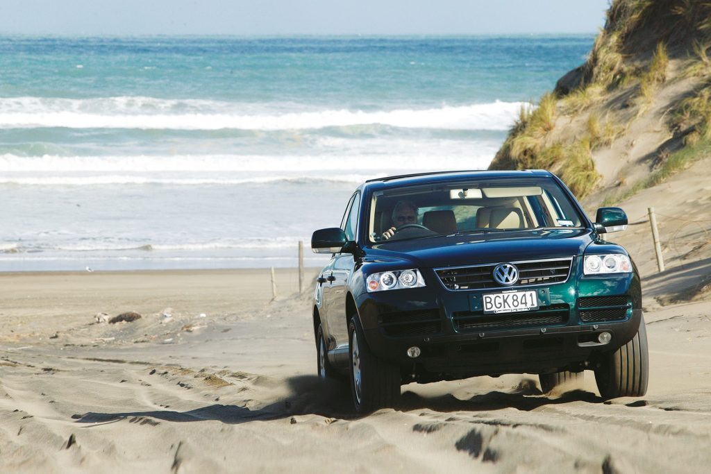 2003 Volkswagen Touareg driving over sand dunes