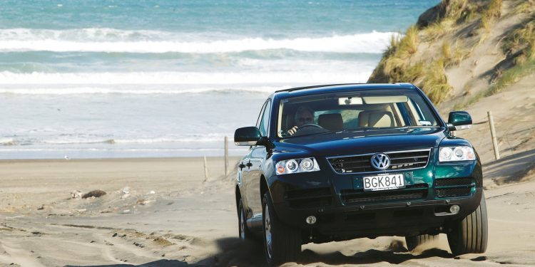 2003 Volkswagen Touareg driving over sand dunes