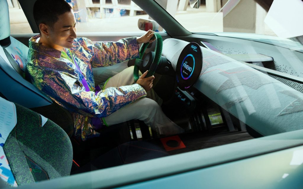 Mini Concept Aceman interior with man sitting in driver's seat